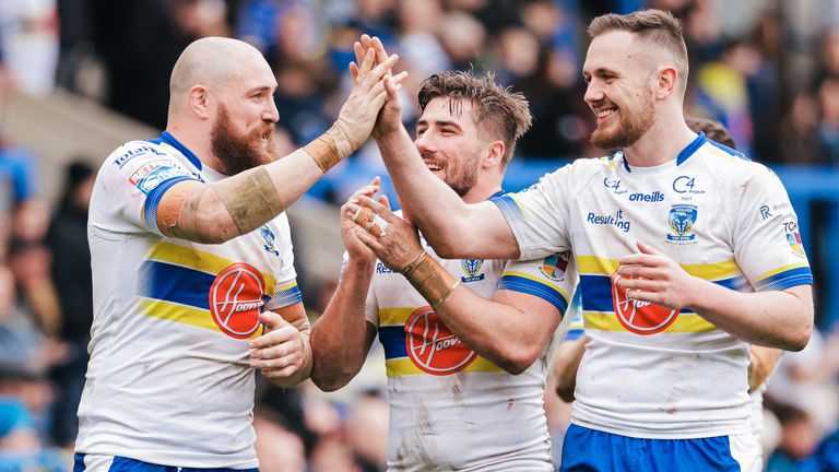 Gil Dudson, Ben Currie and Greg Minikin celebrate Warrington's win over Hull FC