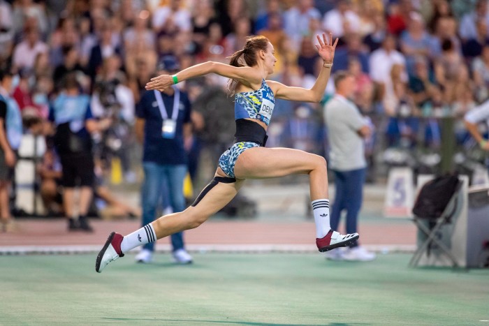 Karyna Demidik of Belarus competes in the high jump at a 2021 international event