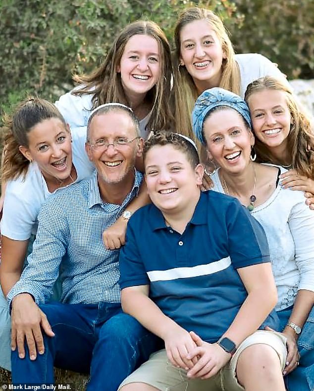 TRAGEDY: Leo and Lucy Dee with their children Keren, 19, left, Maia, 20 and Rina, 15, who were both killed in the attack, son Yehuda, 14, and Tali, 17