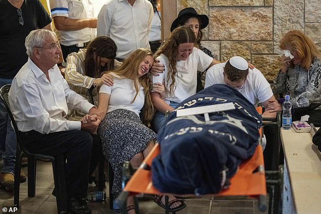 Mourners attended the funeral of two British-Israeli sisters, Maia and Rina Dee, at a cemetery in the West Bank Jewish settlement of Kfar Etzion, Sunday, April 9, 2023