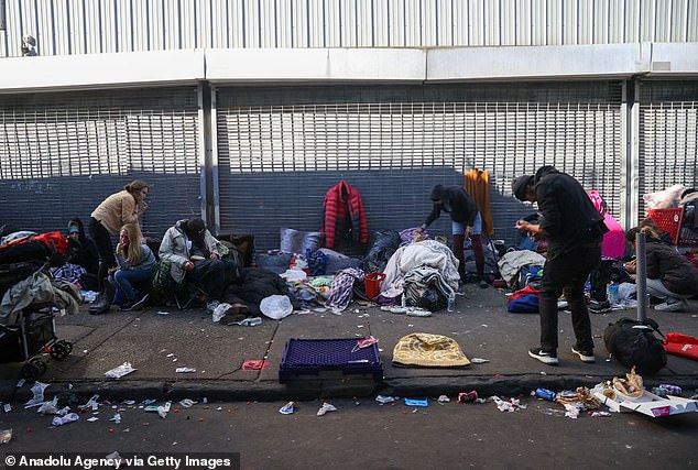 Xylazine prolongs the highs felt from heroin and other street drugs, but results in users passing out for hours at a time, while injection points ulcerate and lead to grisly wounds that spread across the body. Pictured: Homeless people on the streets of Kensington, Philadelphia