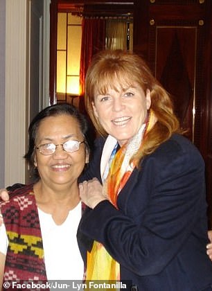 An image shows smiling Sarah Ferguson with JoJo Fontanilla in Manhattan with a shopping bag in her hand