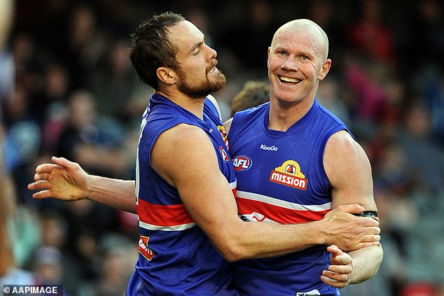 Barry retired from AFL back in 2011 and has gone on to have a commentating career and even turned to boxing last year. Pictured playing AFL in September 2011