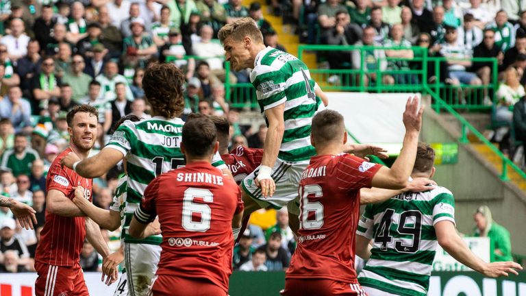 Carl Starfelt rises to head home Celtic&#39;s third goal against Aberdeen