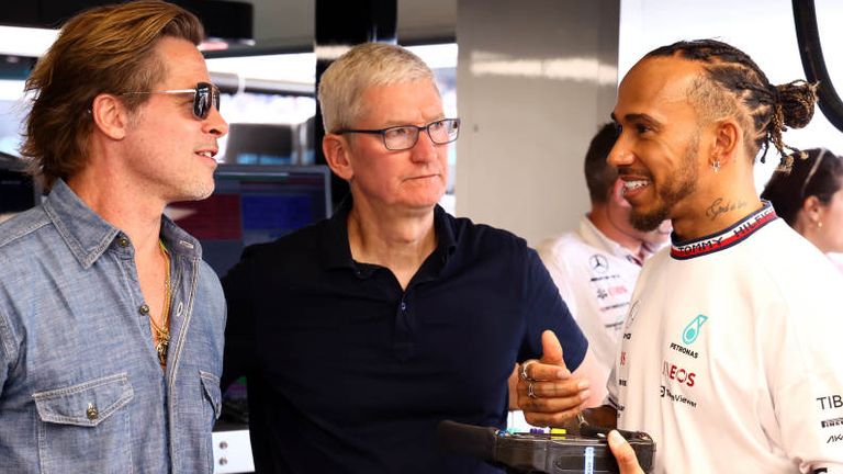 Hamilton met with Brad Pitt (L) and Apple chief executive Tim Cook at last year's US GP 