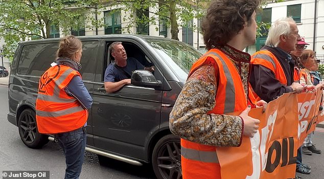 A furious van driver told protesters he needed to get to the hospital