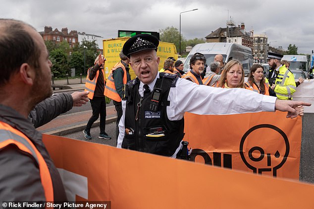 Defiant Just Stop Oil protesters are seen along the A4, West Cromwell Road, near Baron's Court