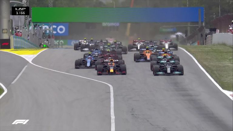 Max Verstappen is the early race leader in the Spanish Grand Prix after out-manoeuvring Lewis Hamilton on the first corner.