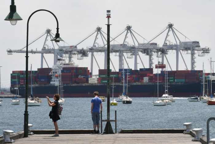 A container ship unloading at Melbourne port