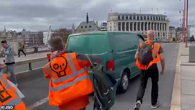 Moment furious motorist drives through Just Stop Oil mob