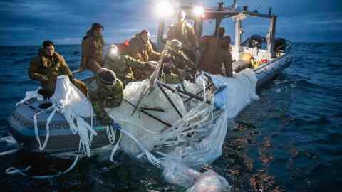 A surveillance balloon is recovered by US staff off the coast of South Carolina