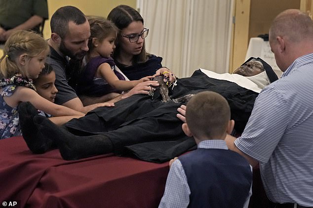 The miracle of Missouri: Thousands of Catholics flock to US church to pray over body of nun