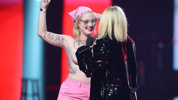 Topless Junos protestor pleads guilty to trespassing, agrees to pay fine