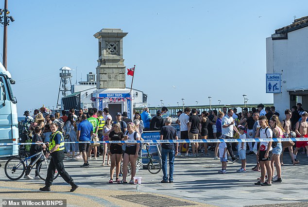 Thousands of people were enjoying the weather before being asked to clear the beach by police