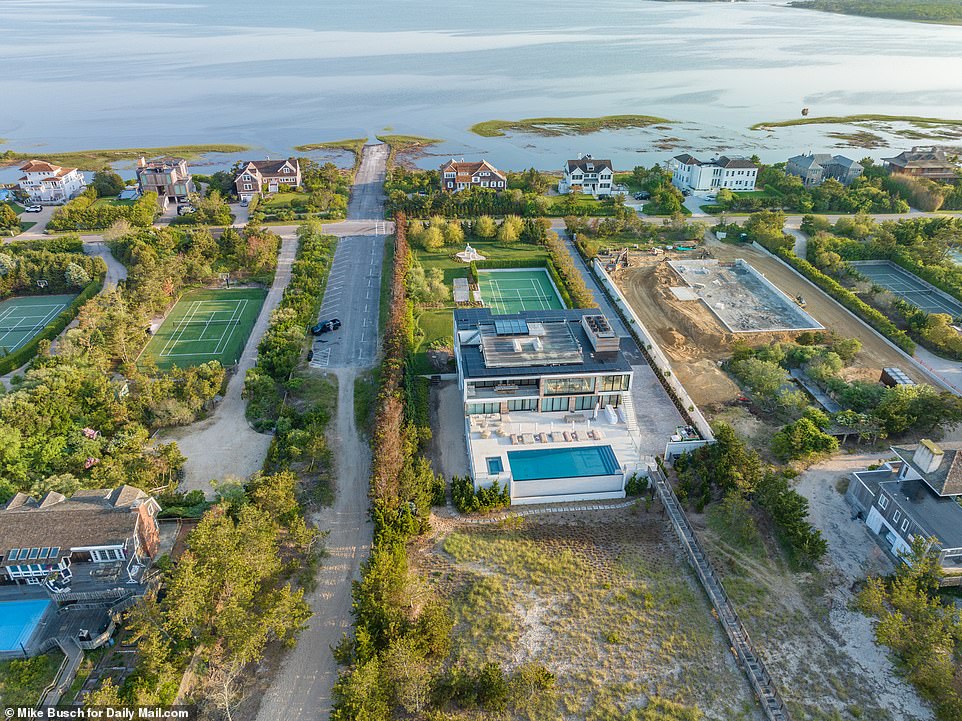 The shark was about 35 yards away from the dead whale, and in close proximity to the million dollar homes that are located near the beach in South Hampton