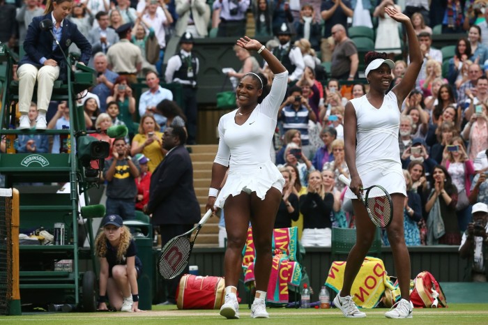 The sisters wave to the crowds during the women’s doubles finals in 2016