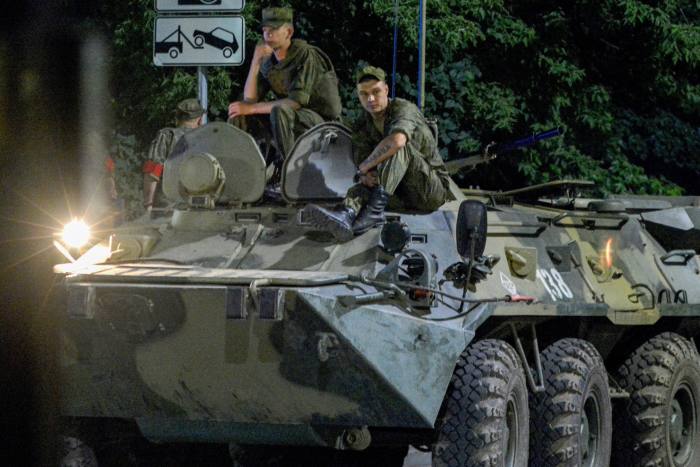 Russian servicemen block a street in downtown Rostov-on-Don