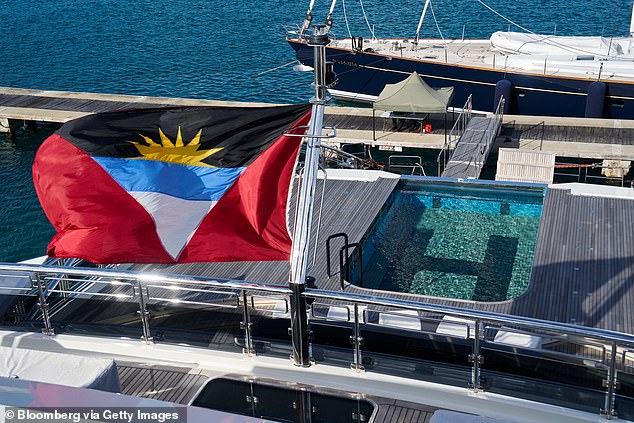 The ship boasts the first ever swimming pool that can turn into a helipad (pictured)