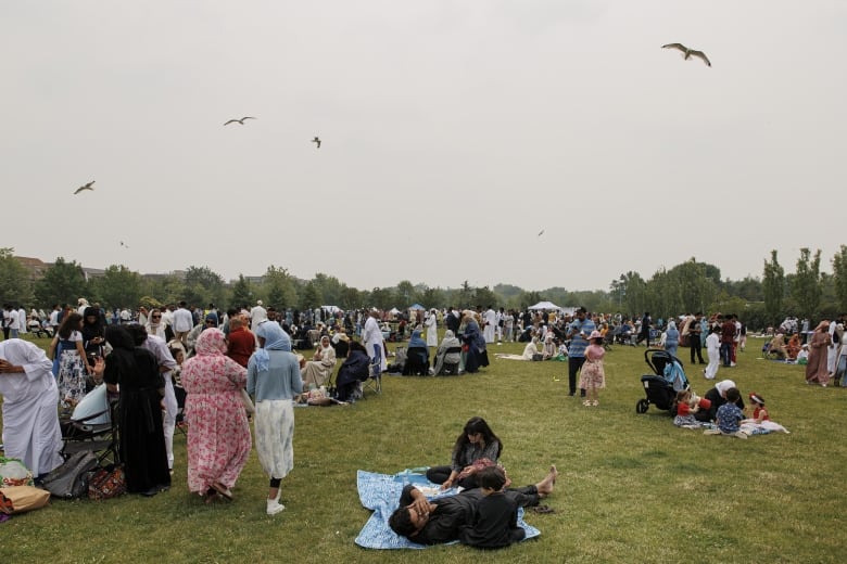 People at a park celebrating Eid al-Adha in Toronto.