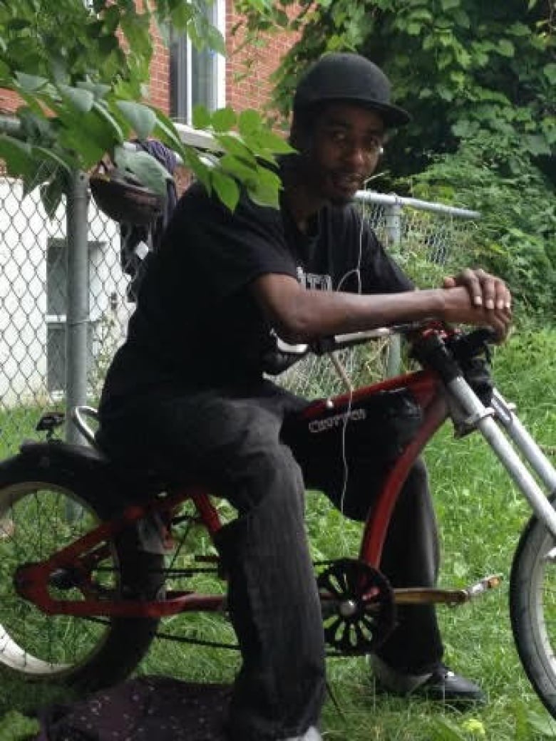 Man sitting on a bike. 