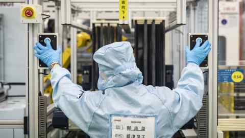 Worker at a solar panel plant in China