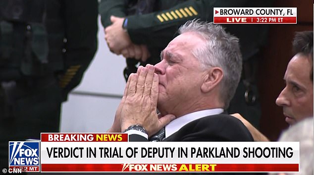 Parkland deputy who FLED to safety during massacre breaks down in court as he is found not guilty