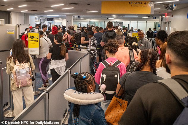 Thousands of miserable passengers cram into security at NYC airports as piles of bags mount at LAX