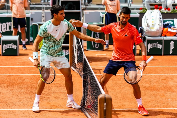 Alvarez and Djokovic greet each other over the net