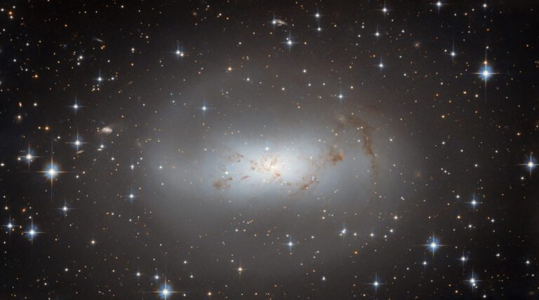 Hubble checks in on highly irregular galaxy ESO 174-1