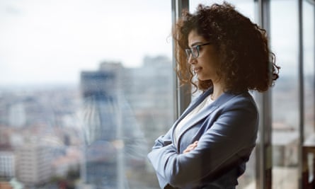 Woman looking out of office window