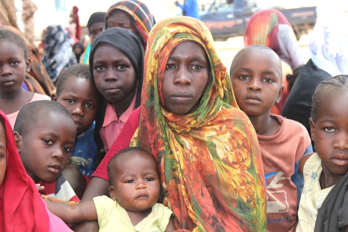 Djamila Ibrahim, carrying her six-month-old baby in the Chadian village of Koufroun