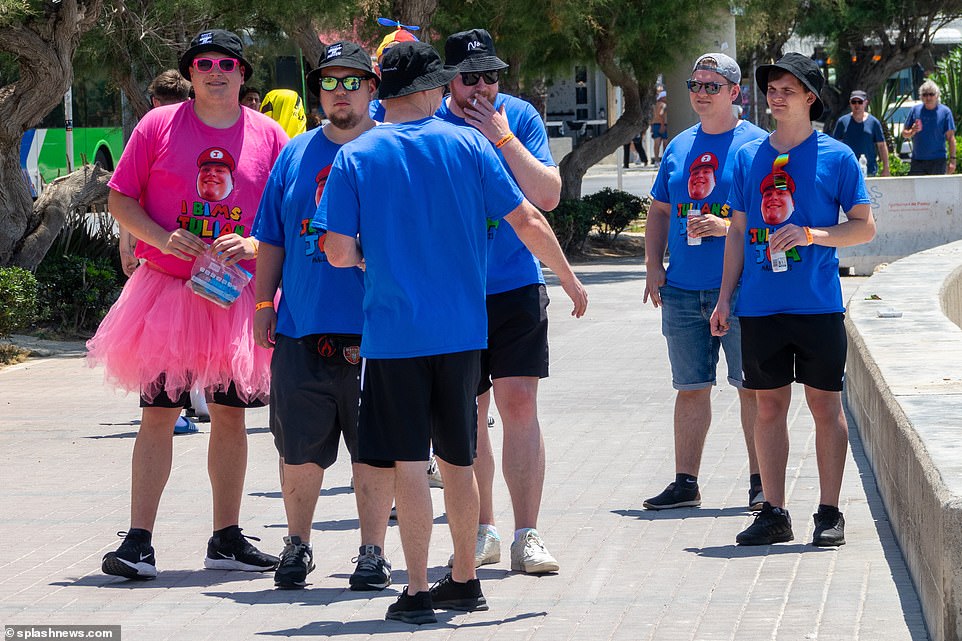 Some less serious pals plastered themselves in a friend's face as they wore matching outfits on their day out