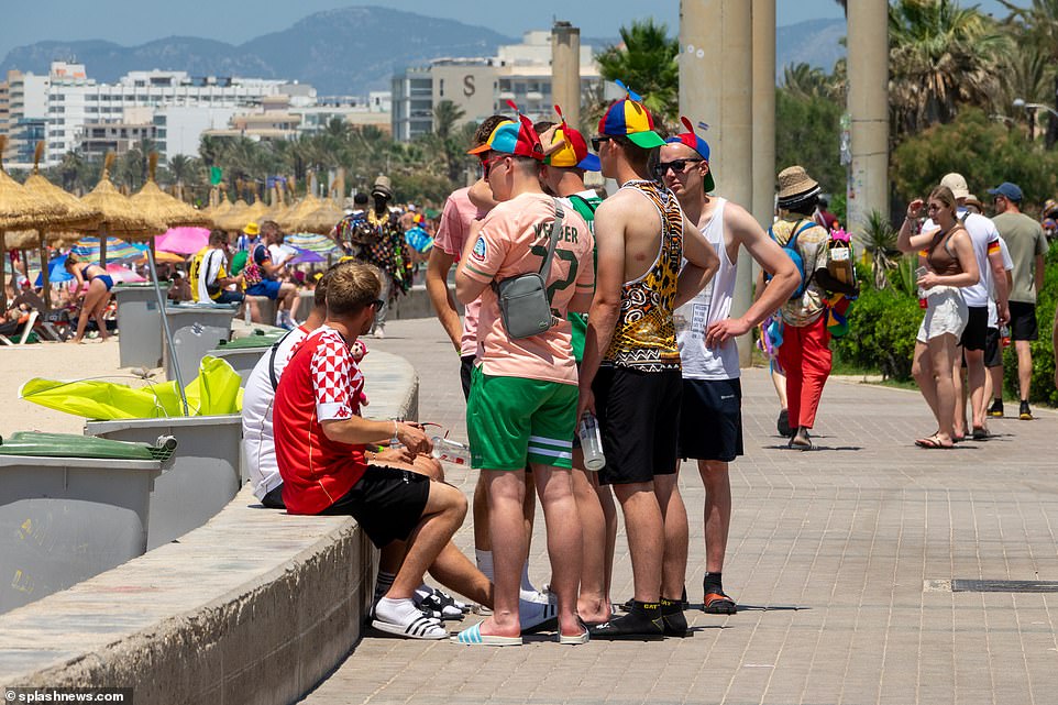 Wacky outfits were the order of the day - with rainbow windmill hats providing some much-needed shade