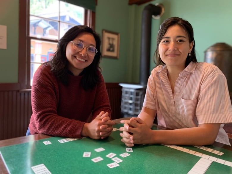 Alison Gu (left) sits on Burnaby City Council, which is launching a review of historic discrimination against Chinese Canadians. Gu's partner Gillian Der (right), descended from CPR builders and head tax payers. 