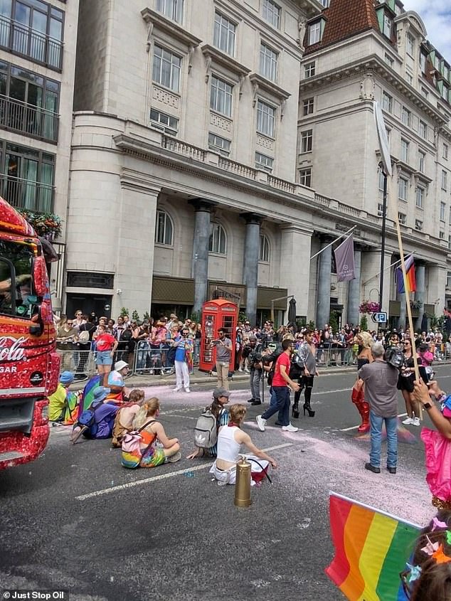 At around 1:25pm, the group sat down in front of the festival's Coca-Cola float