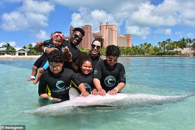 The Barrett family pictured together before tragedy struck - their three surviving children are sons Shaquil Jr. and Braylon, and daughter Aaliyah