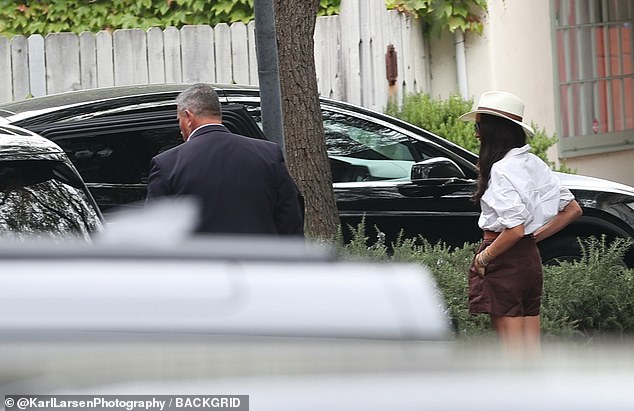 The couple appeared to be in great spirits as they left the office building and walked to their car