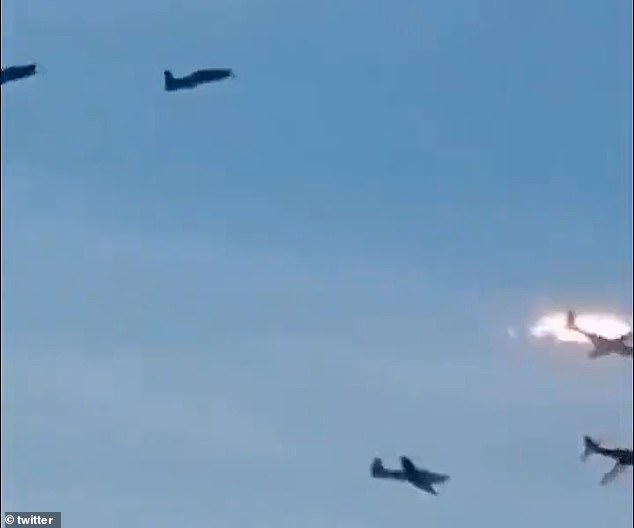 In one widely viewed clip, the two low-flying planes are seen getting dangerously close - as the rest of the five-plan fleet looks on - before eventually colliding