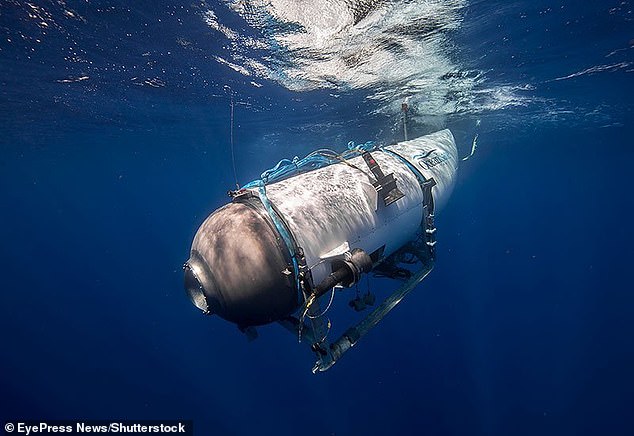 The submersible, Titan, is pictured descending. It was the only five person sub capable of reaching Titanic