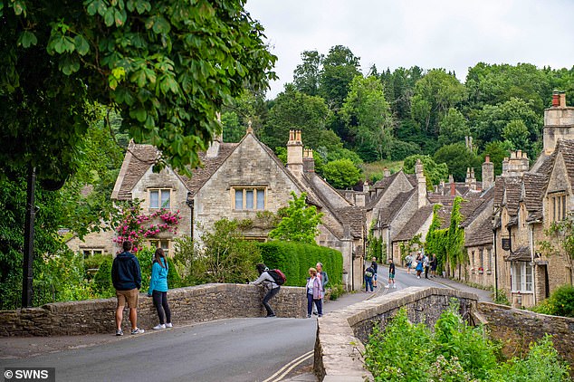 Every year, holidaymakers flock to the popular tourist destination in their thousands, leaving Castle Combe (pictured) residents instructing many to get off their land