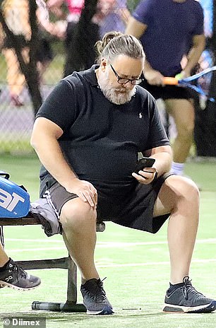 My, how you've changed! The Hollywood legend sported a scruffy beard and wore his greying hair in a slicked-back ponytail while playing a game of tennis in Sydney in 2020