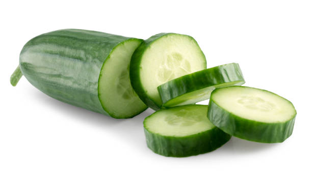 green cucumber with slices isolated on a white background stock photo