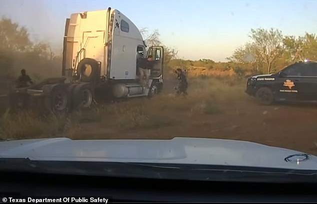 As they shout for a fleeing Aradasto stay still, several of the migrants can be seen fleeing the truck as well