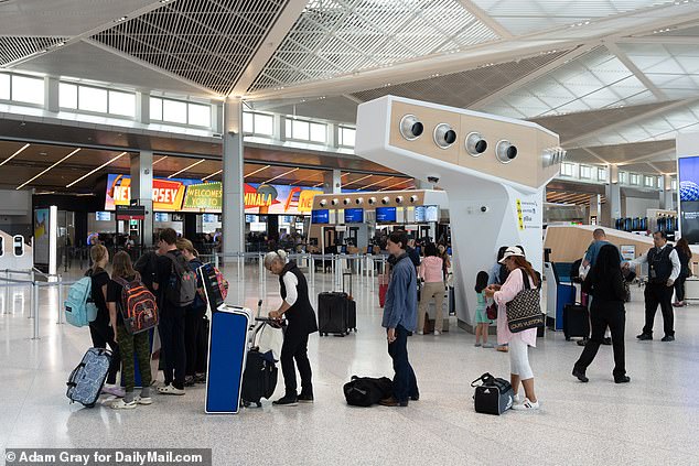 People travel through Newark Airport ahead of the July 4th Holiday on Monday