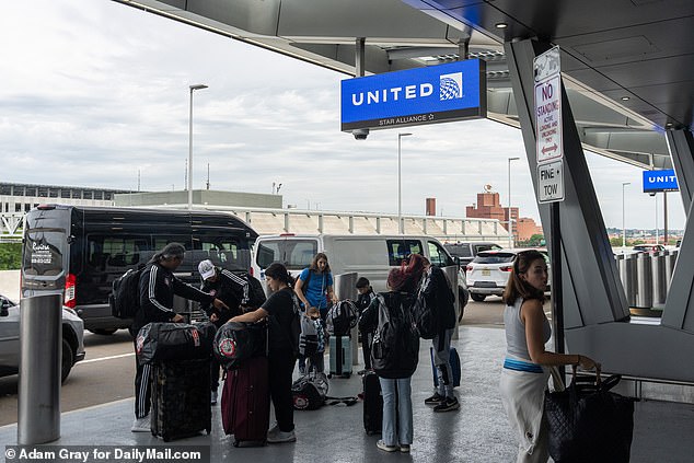 People were still traveling for the July 4th holiday on Monday - pictured here at Newark, NJ