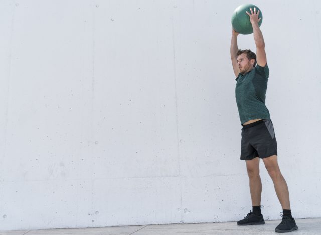 man doing medicine ball slams