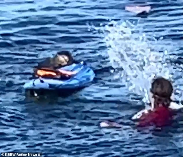 In the clip, the surfer rushes after the otter and becomes enveloped in a full-blown water fight, splashing water at the mammal to try and get him to leave