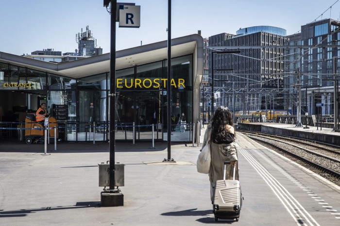 A woman walks in front of the Eurostar Terminal at Amsterdam Central Station last month