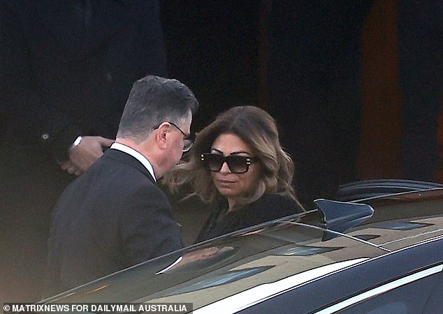 Moradian had his wife Natasha's named tattooed on his hand. Natasha Moradian is pictured (right) at his funeral on Wednesday