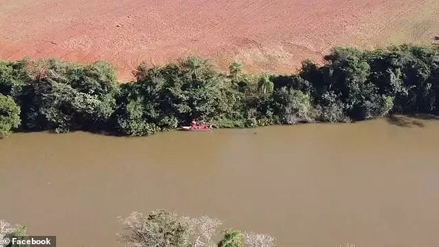 Authorities canvas the Iguatemi River where the remains of Hugo Skulny were recovered Sunday. The 19-year-old's head is still missing